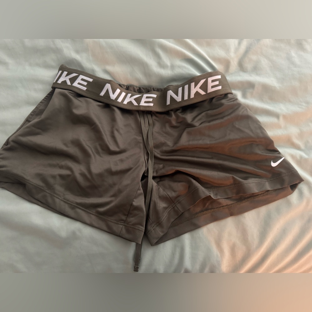 Nike “Dri Fit” olive green shorts.